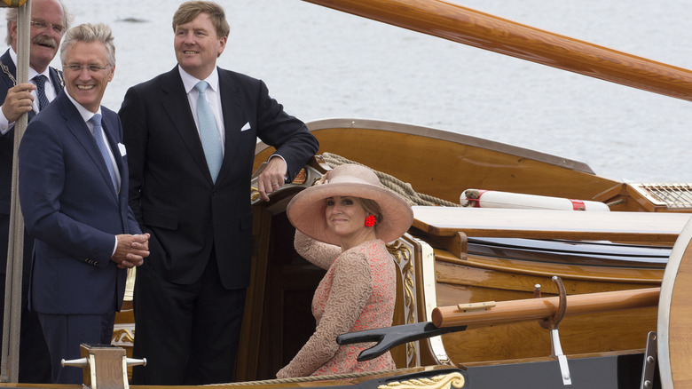 Queen Máxima wearing a hat on a boat