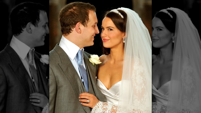 Sophie Winkleman and her husband Lord Frederick Windsor smiling in their wedding outfits