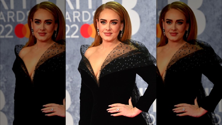 Adele posing on step-and-repeat