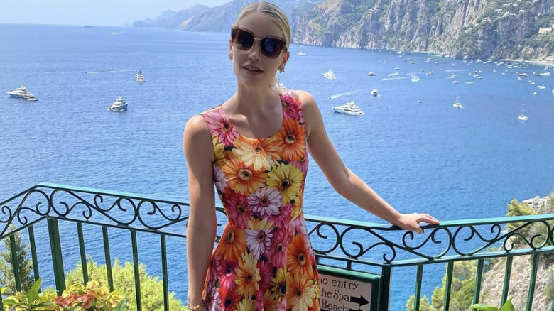 Lady Kitty Spencer posing against an ocean backdrop on her honeymoon in Positano