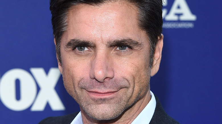 john stamos posing