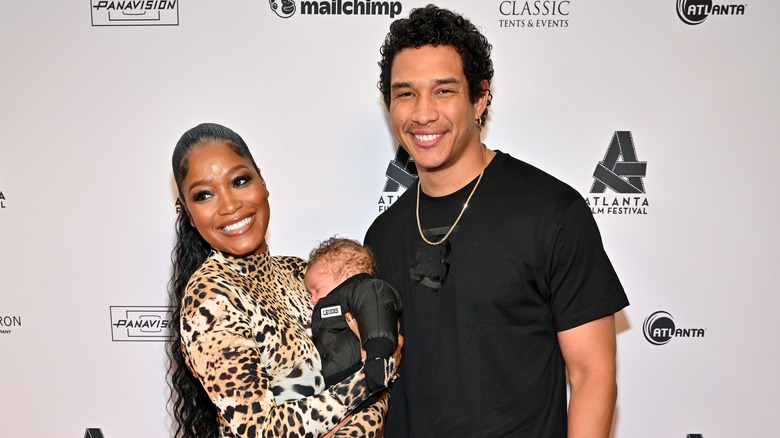 Keke Palmer and Darius Jackson posing for photos with son Leodis