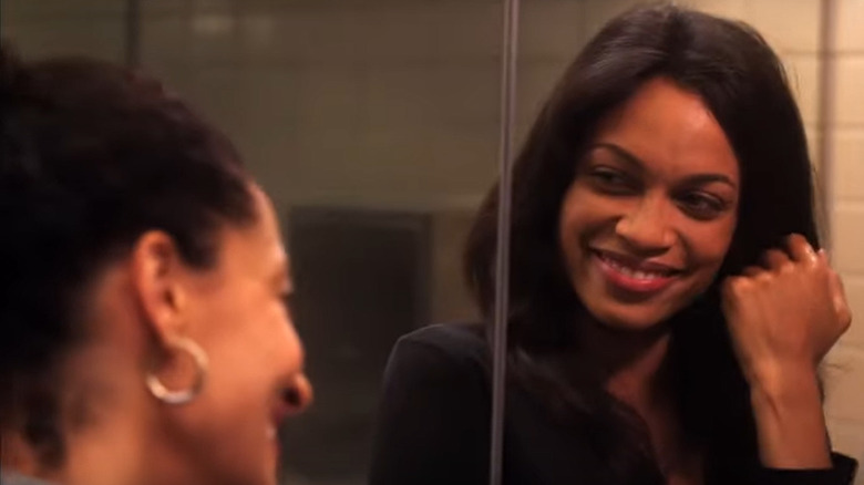 Rosario Dawson smiling at Tracee Ellis Ross in Five