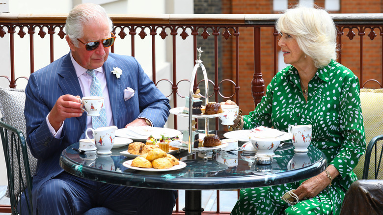 Charles and Camilla having tea