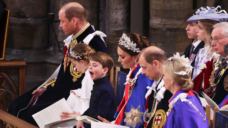 Prince Louis yawns during coronation ceremony