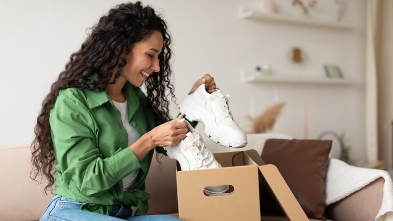 Woman unboxing a pair of shoes