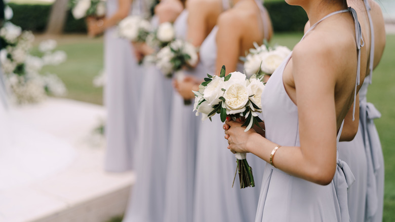 Bridesmaids holding bouquets