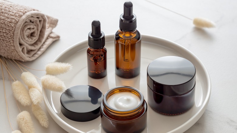 Skincare bottles on a tray