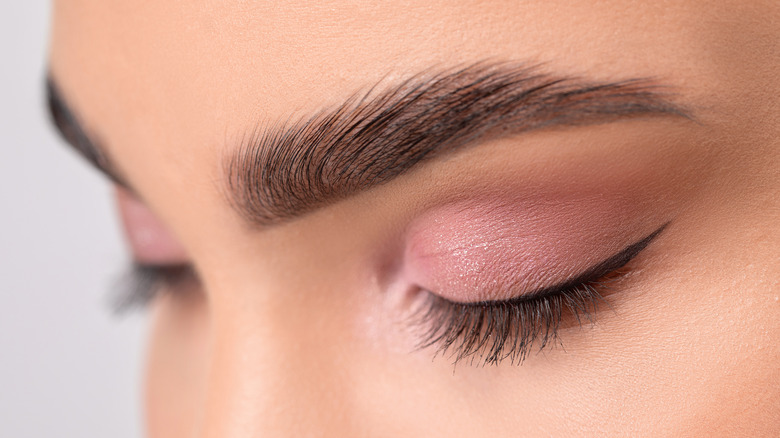 Close up on woman wearing eyeliner