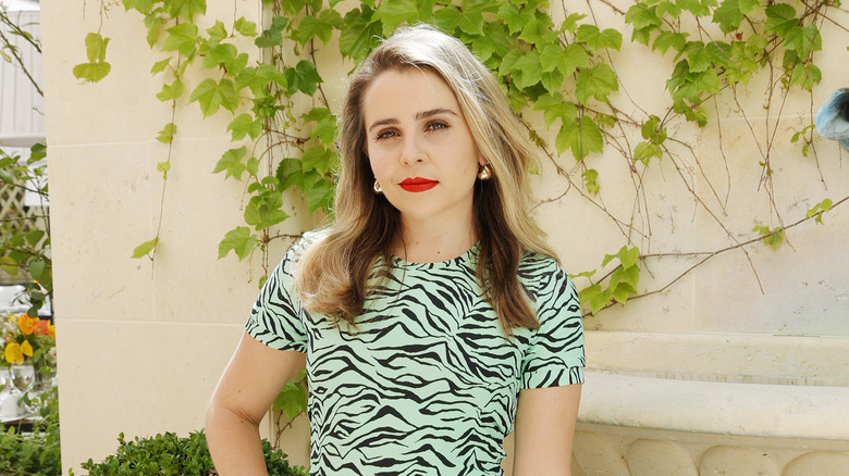 Mae Whitman posing outside