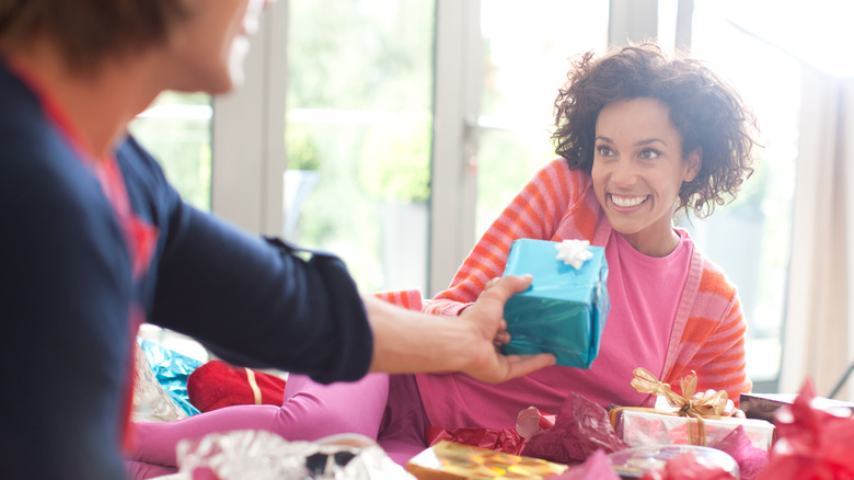 Man gives woman gifts