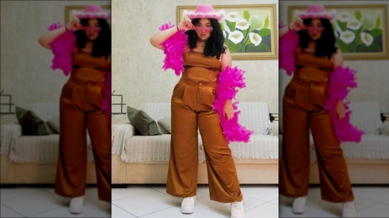 woman in cowboy hat and feather boa