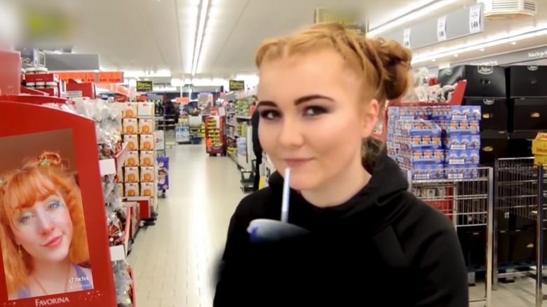 Millie B, UK-based grime artist posing in a store