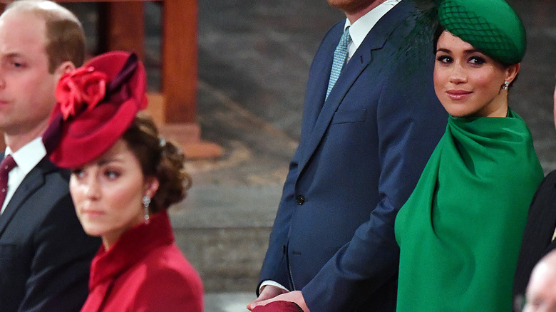 Kate Middleton and Meghan Markle in red and green, respectively 