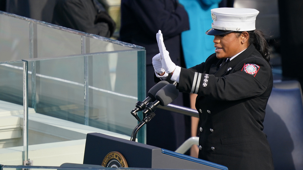 Andrea Hall signing the Pledge of Allegiance