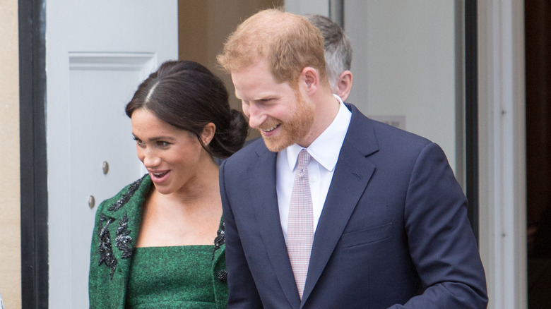 Meghan Markle and Prince Harry looking to the side