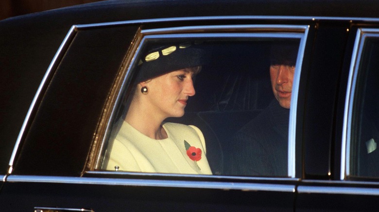 Princess Diana looking unhappy in a car