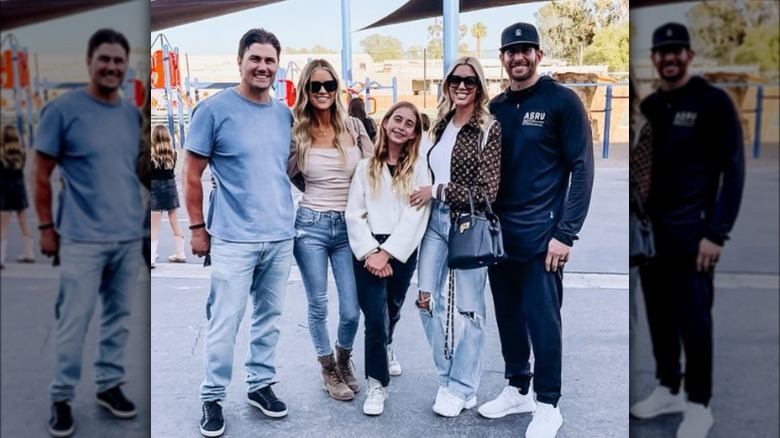 Josh and Christina Hall, Tarek and Heather Rae El Moussa pose with daughter