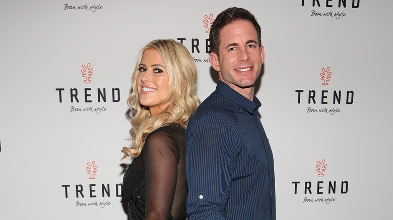 Christina Hall and Tarek El Moussa standing back to back in 2016