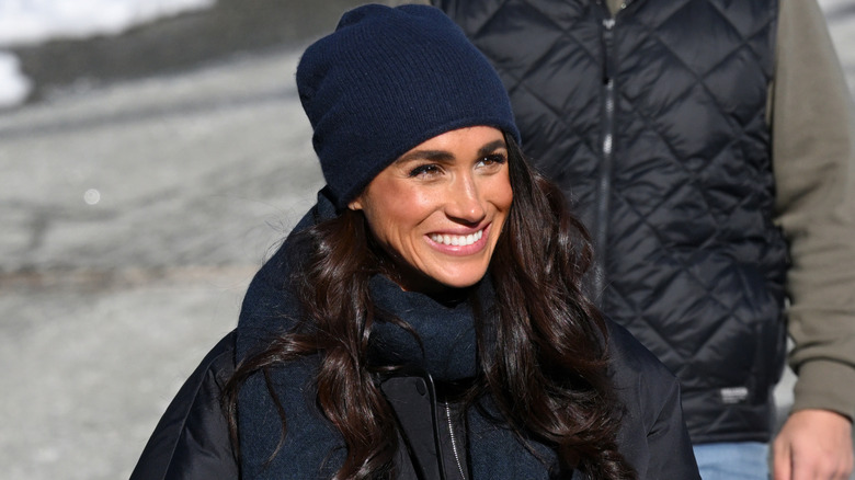 Meghan Markle smiling in beanie hat