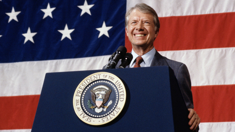 Jimmy Carter standing behind podium