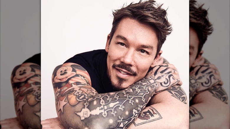 David Bromstad displaying some of his tattoos