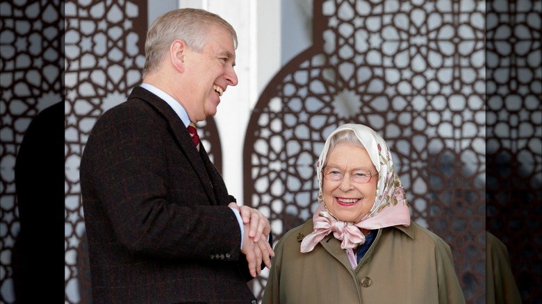 Prince Andrew and Queen Elizabeth smiling and laughing together together