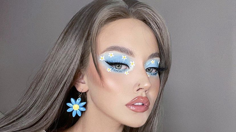 woman with daisy eye makeup