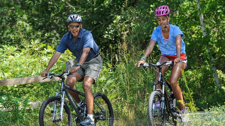 Barack Obama and Malia Obama riding bikes on Martha's Vineyard