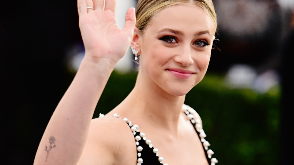 Lili Reinhart waving, smiling