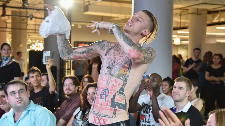 Machine Gun Kelly performs shirtless