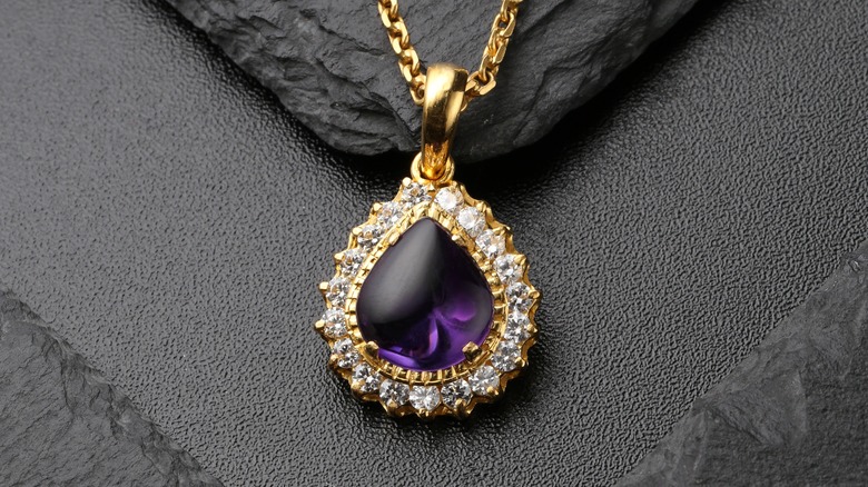 Amethyst necklace pendant on slate 