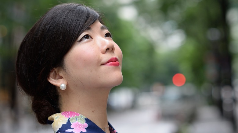 Woman wearing pearl earrings