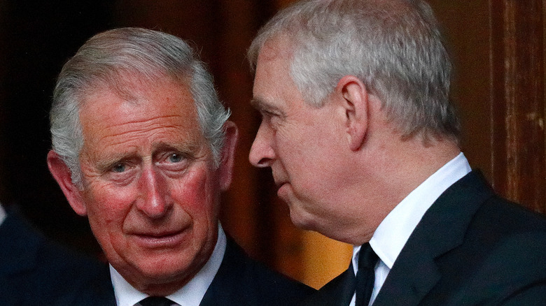 King Charles and Prince Andrew talking