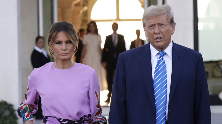 Melania and Donald Trump frowning