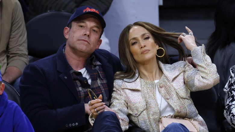 Ben Affleck sitting next to Jennifer Lopez