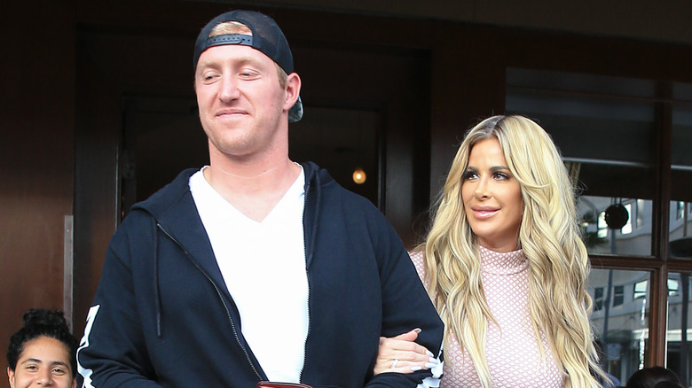 Kroy Biermann and Kim Zolciak walking