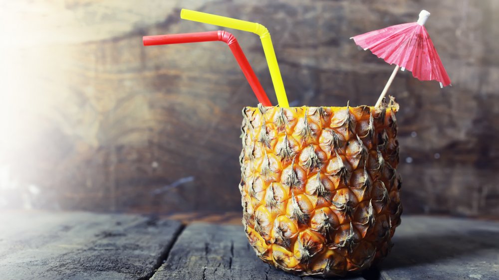 Pineapple with cocktail umbrella