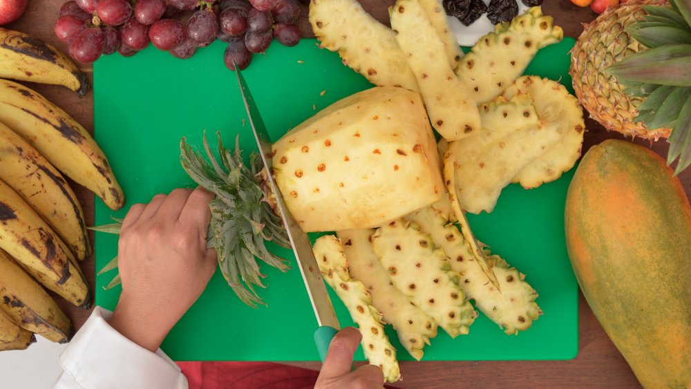 Cutting pineapple