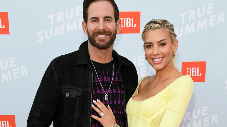Heather and Tarek El Moussa pose together at an event