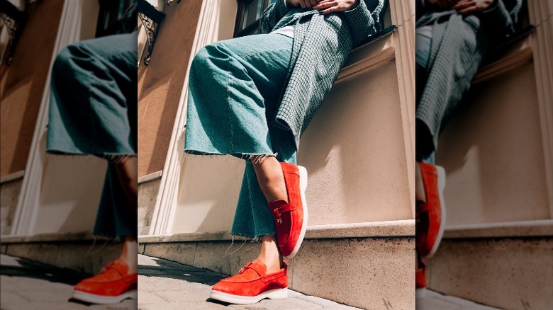 Woman wearing red loafers