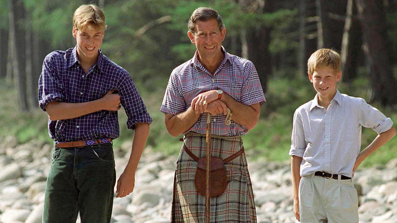 Young Prince William, King Charles, and Prince William stand outside together