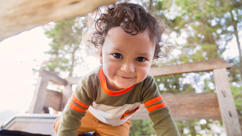 baby boy crawling outside