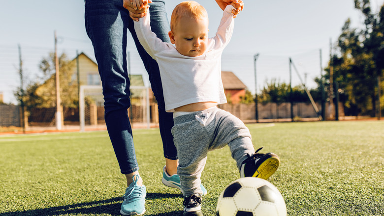 baby kicking soccer ball