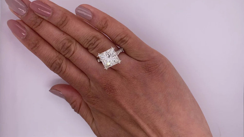 Woman wearing princess cut engagement ring