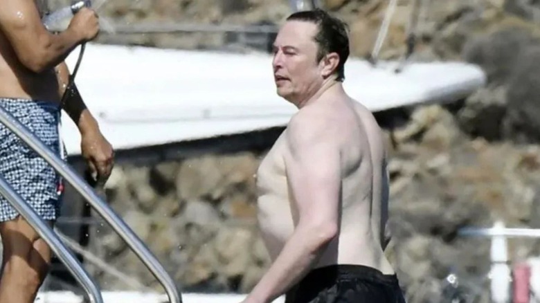 Elon Musk shirtless on a boat