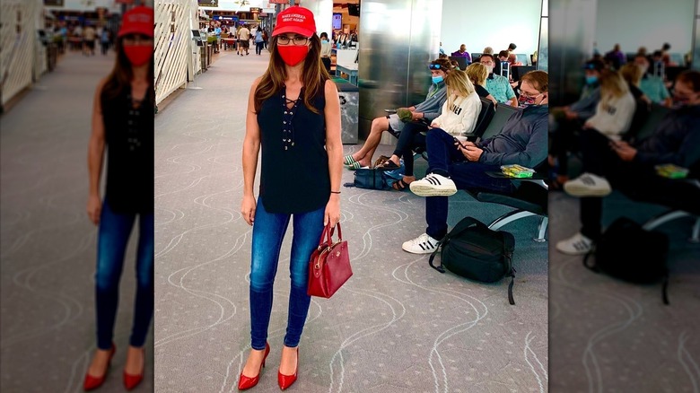 Lauren Boebert wears MAGA hat and red mask