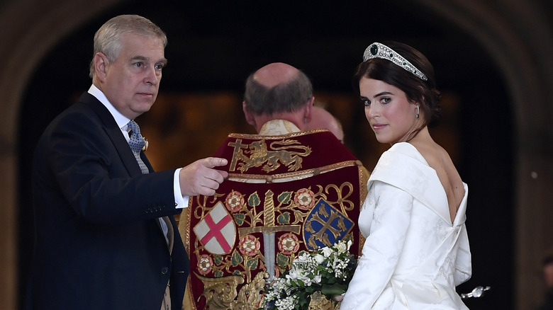 Prince Andrew, who had an awkward royal family interview, with Princess Eugenie at her wedding