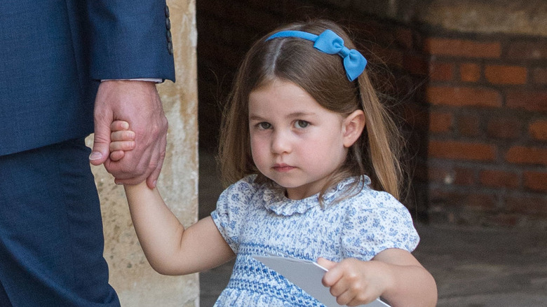 Princess Charlotte at Prince Louis' christening, where there was an awkward royal family interview