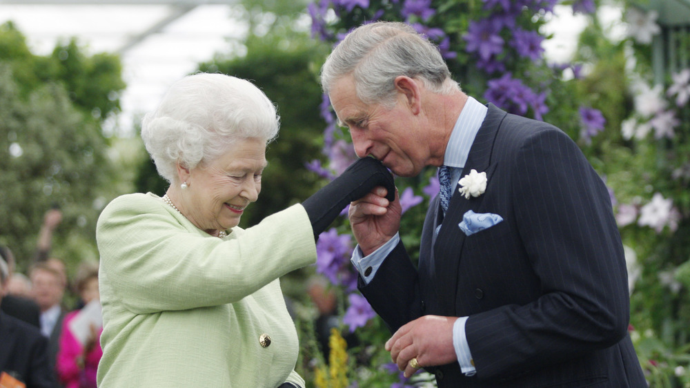 Prince Charles kissing Queen Elizabeth's hand